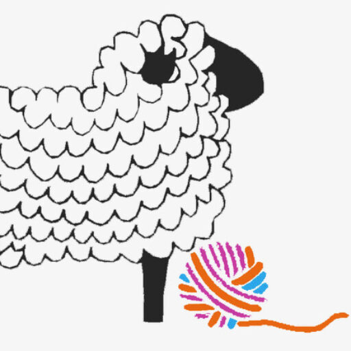 white sheep and ball of yarn