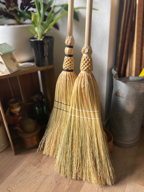 Two upright brooms, handmade