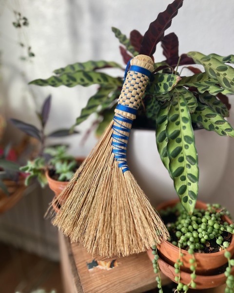 handmade whisk broom with blue ribbon